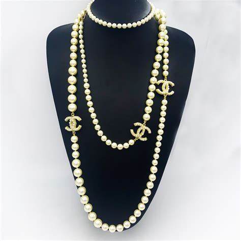 gold chanel pendant necklace|Chanel pearl long strand necklaces.